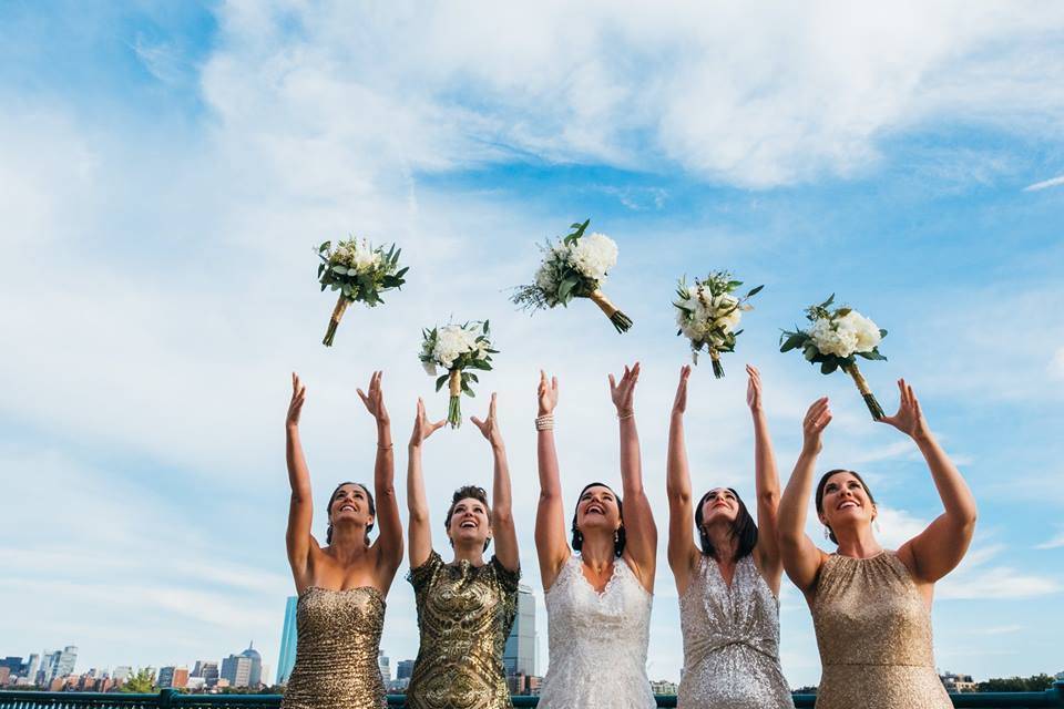 Bridal party toss their bouquets