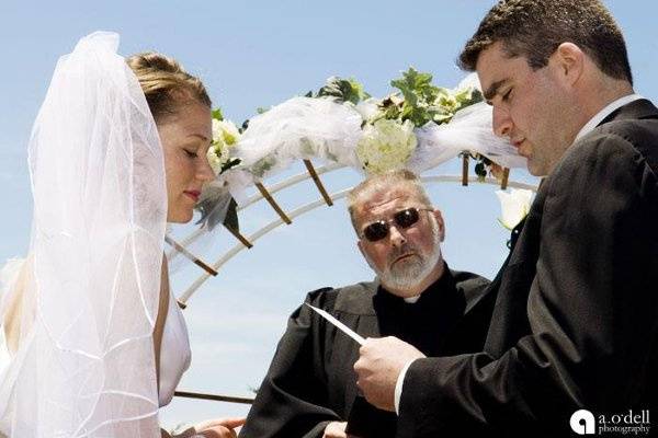 Reverend at a beach wedding