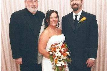 Newlyweds with the officiant