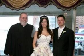 Bride and groom with the officiant