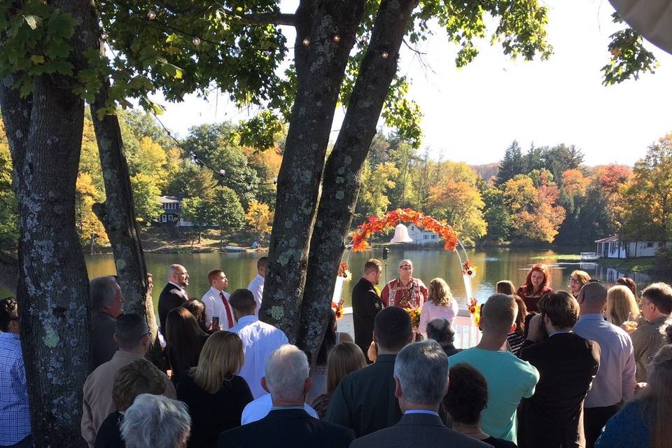 Outdoor ceremony in front of the water