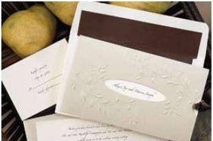 BrillianceLet your love shine thru! Your names will appear in your choice of lettering style and ink color thru the die-cut window in the golden pocket with embossed filigree design. Complete the look by selecting an Antique White, Black, Claret, or Mocha ribbon. 8 1/2” x 5