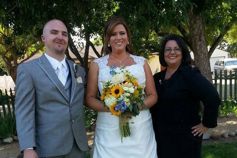 The newlyweds and officiant