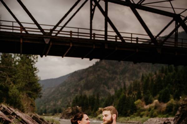 Bride and groom by river