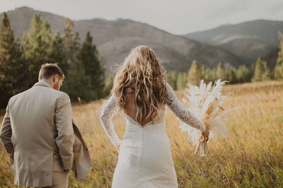 Bride and groom in field