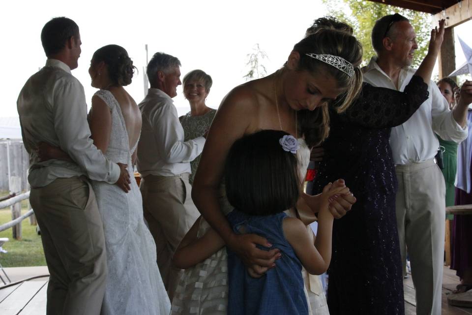 Bride dancing with little girl