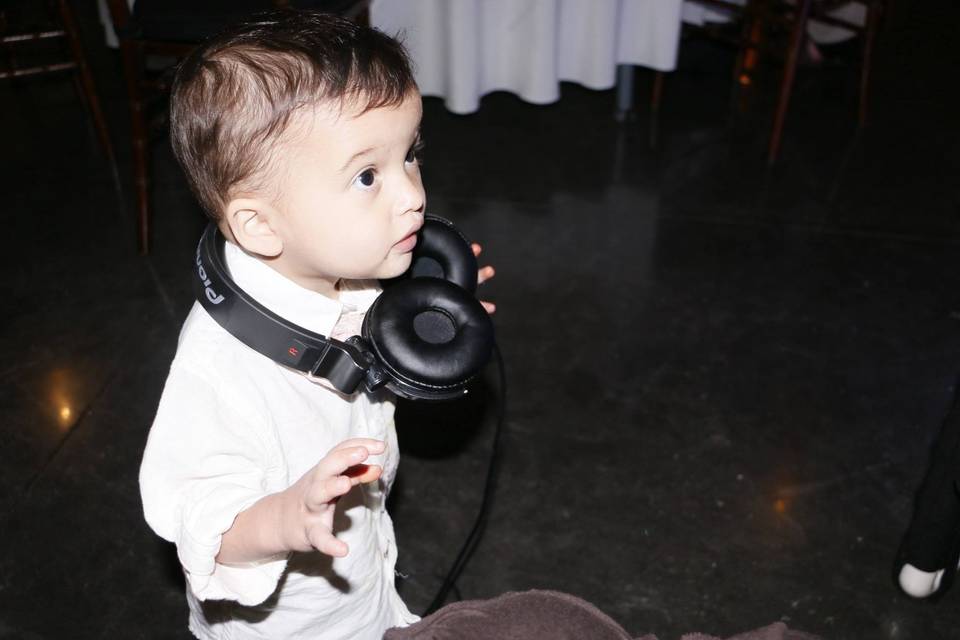 Little boy with the DJ's headphones