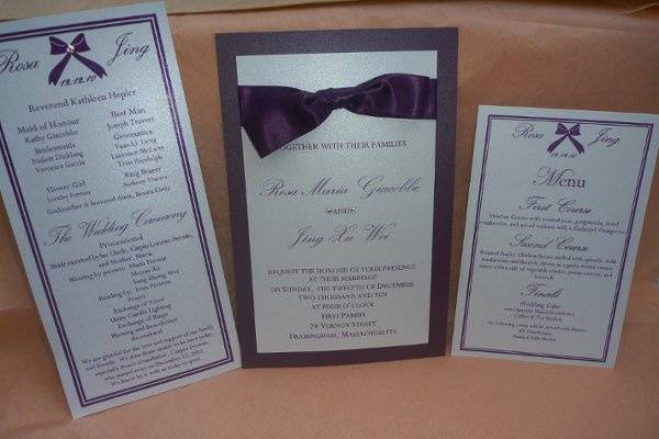 Our December bride was having an evening winter wedding.  A touch of rich purple satin and added swarovski crystals completed the look for her wedding invitation.  We carried the theme through to the program and menu.