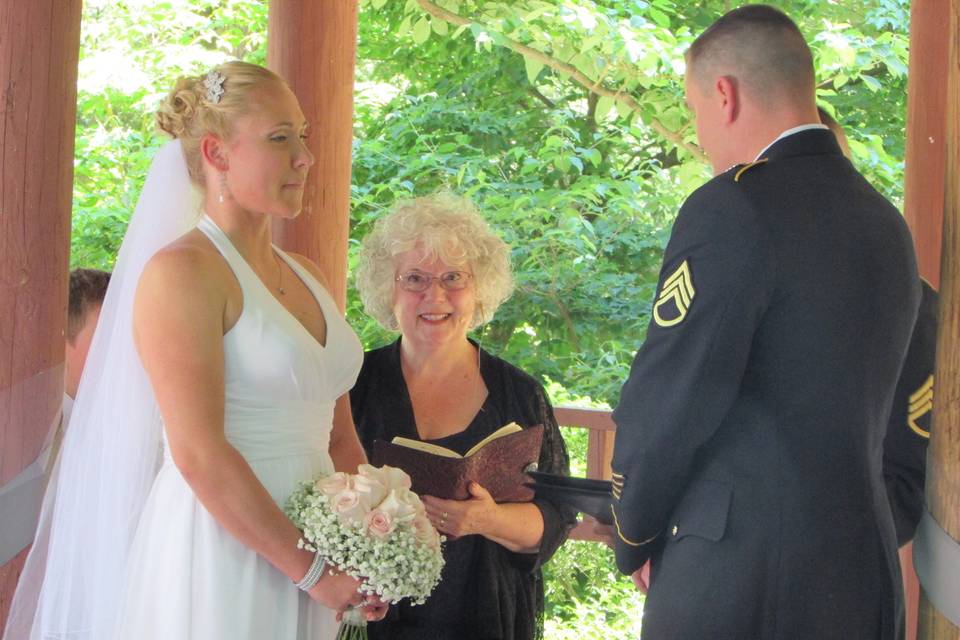 CT officiant Zita Christian with bride and groom, both active military, at their wedding in Wickham Park, CT