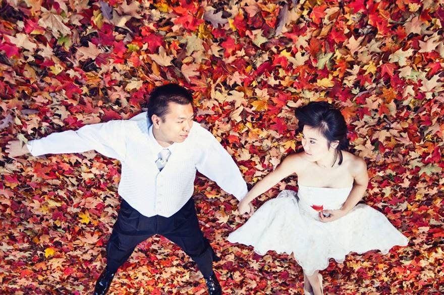 A couple laying in the beautiful Fall Leaves in NE PA