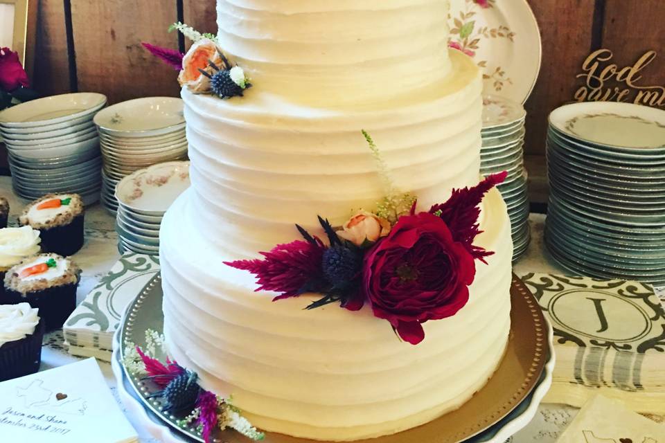 Wedding cake with red flowers