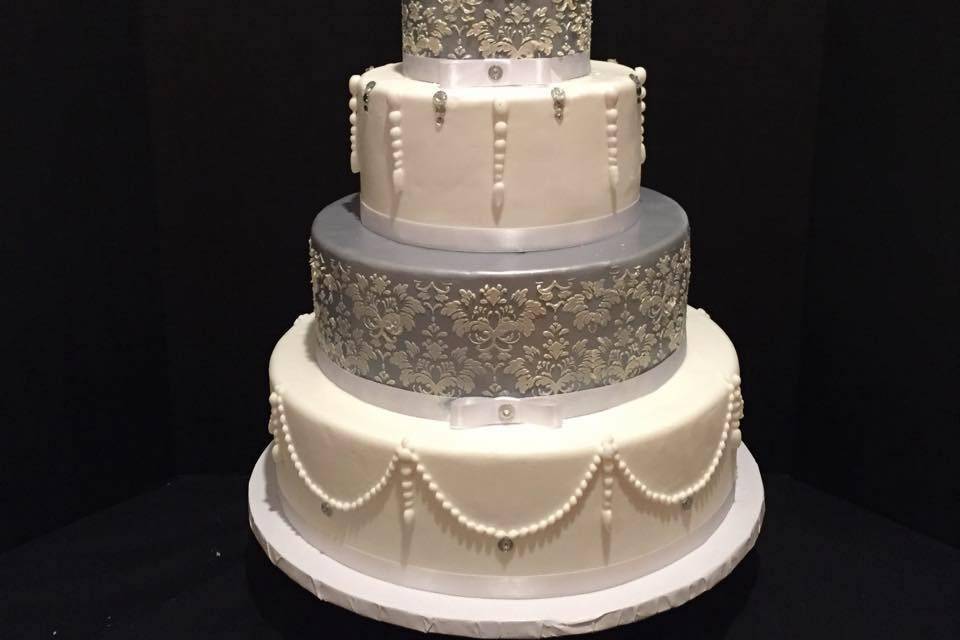 Custom silver and white wedding cake. Handmade pearls, hand piped damask pattern.