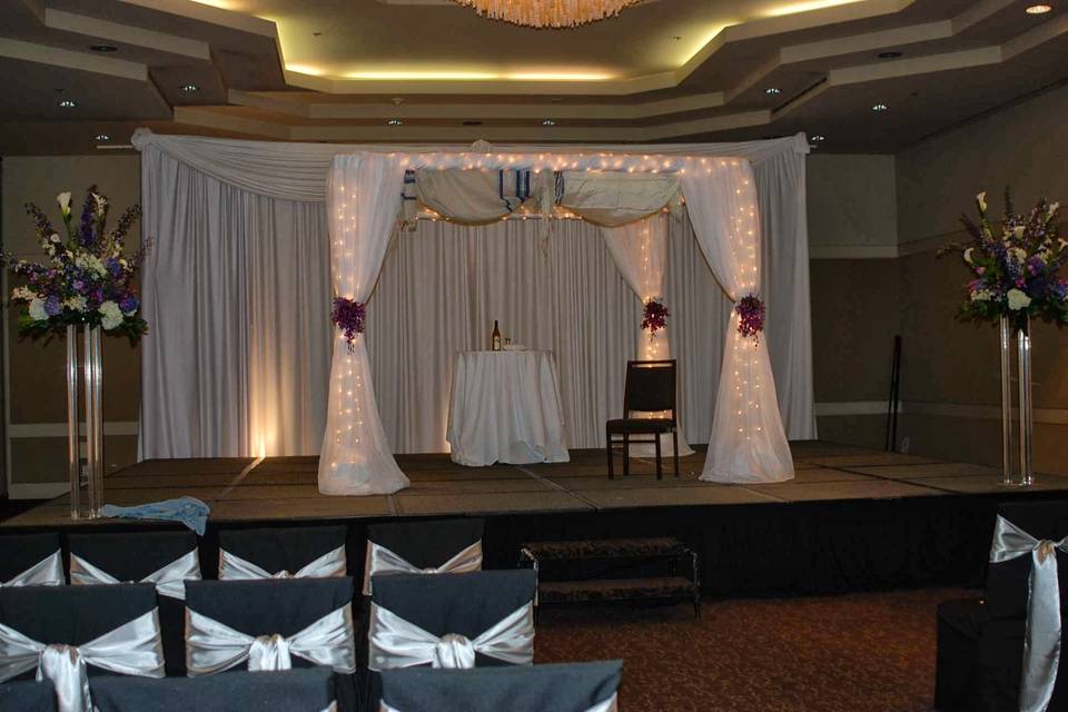 White drape wedding arch