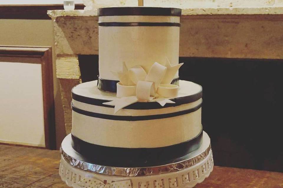 Buttercream barrel cake with fondant accents.