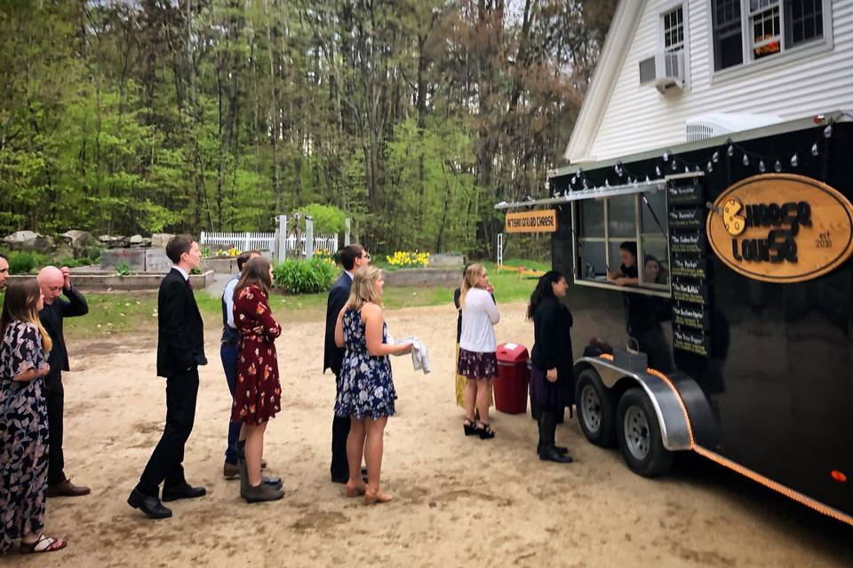 Guests queue for sandwich bites