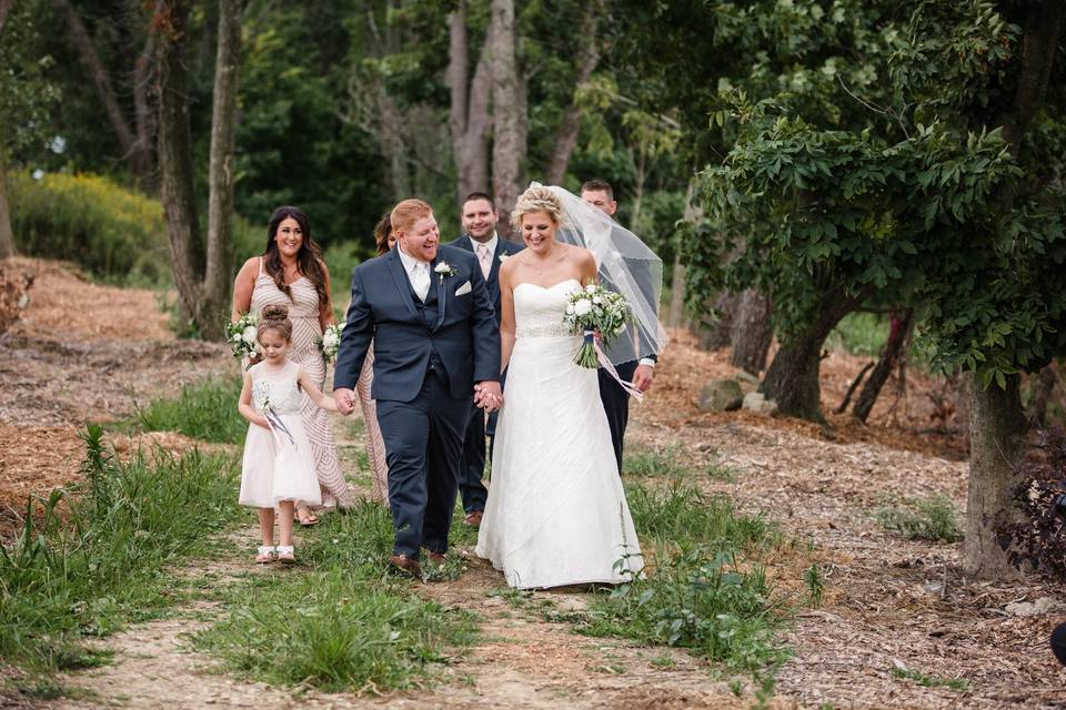 Couple with wedding attendants