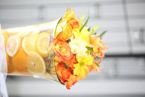 Fresh Fruit with circus roses, confetti roses,carnations, daisys & altramaria centerpiece