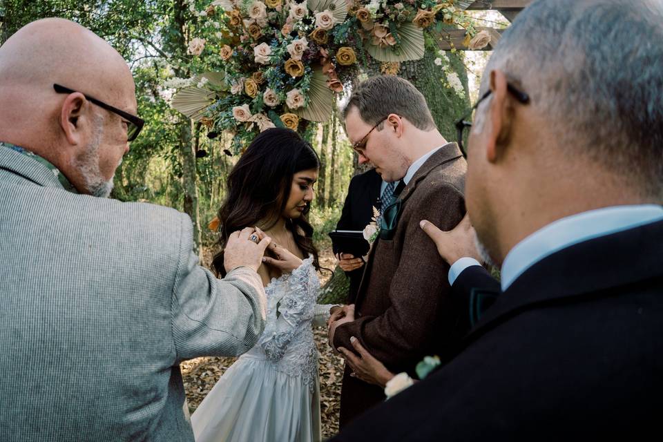 Praying over the couple