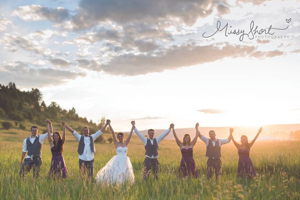 The couple with the bridesmaids and groomsmen