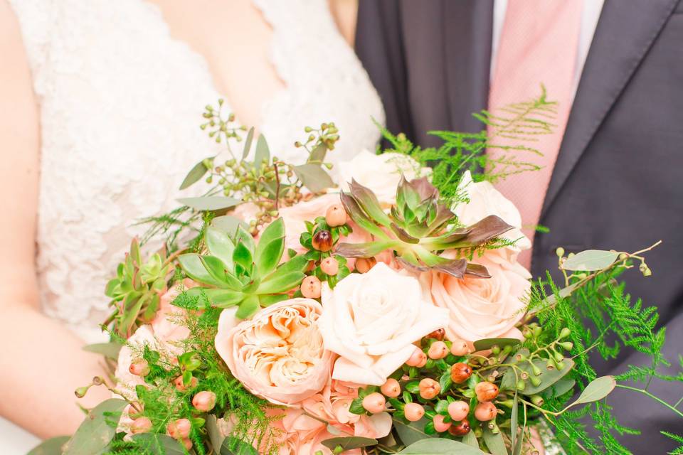 Couple holding the bouquet