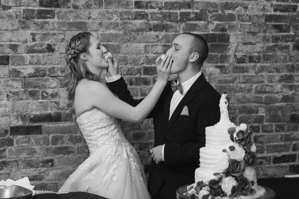 Bride and Groom enjoying cake