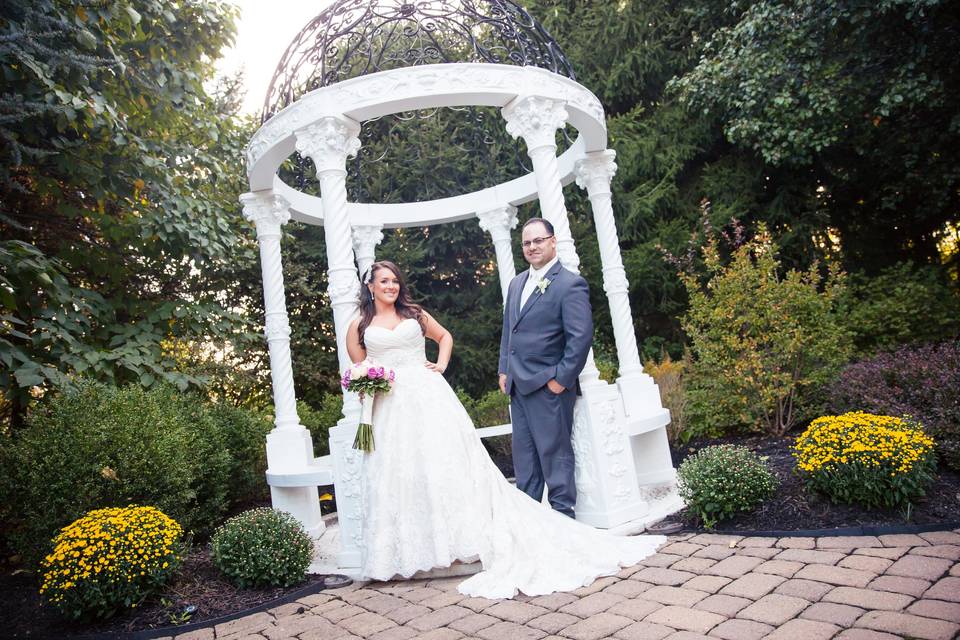 Newlyweds in the garden | Photo by Montclair Studio