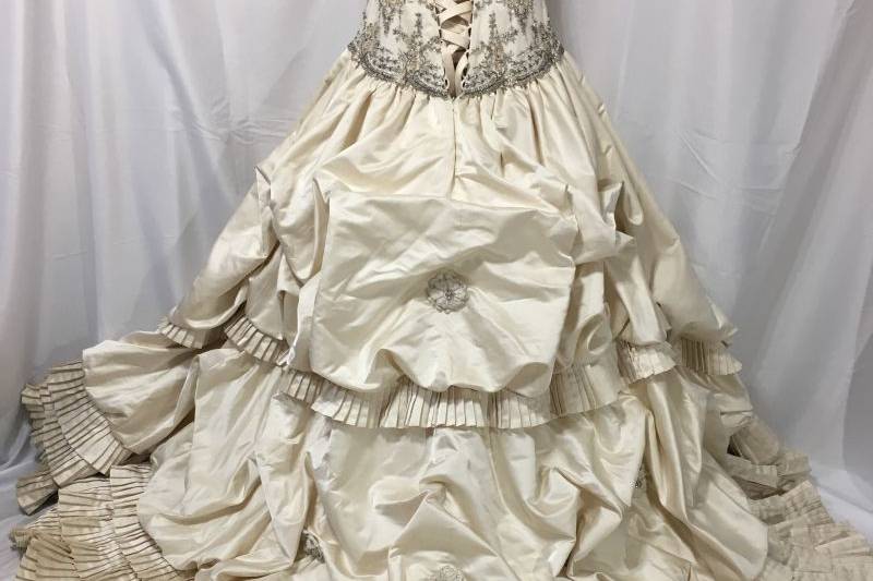 One of the most intricate antique looking  wedding gown with hundreds of pleats.  This gown was preserved.