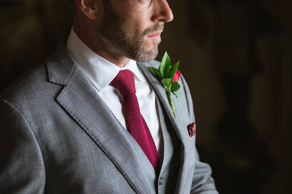 Wedding portrait in suit with red tie