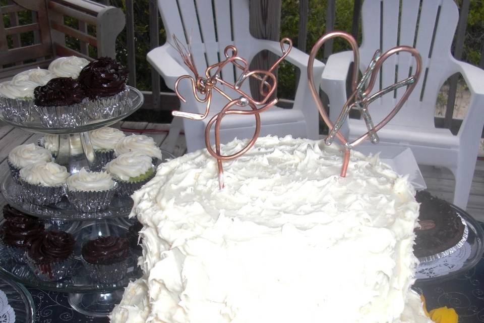 Shabby chic wedding cake... love their unique copper toppers