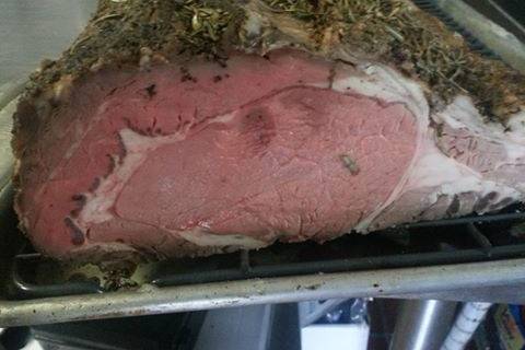 Succulent herb encrusted prime rib slow roasted to perfection