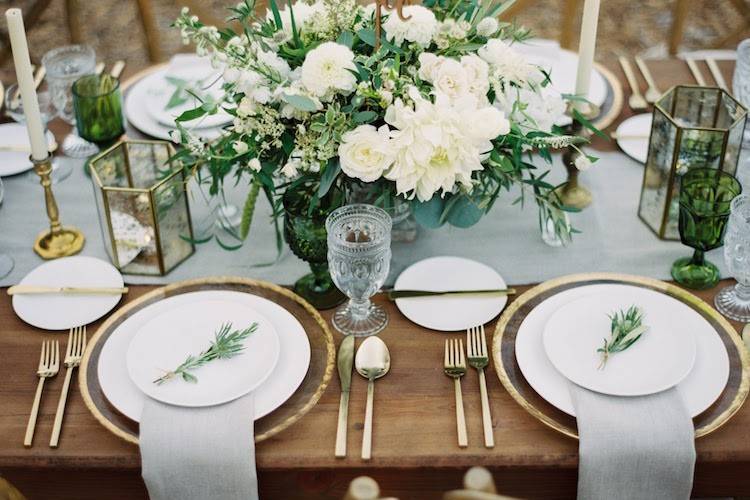 Table settings featuring fresh herbs
