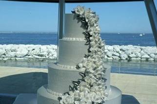 White cake with ascending flowers