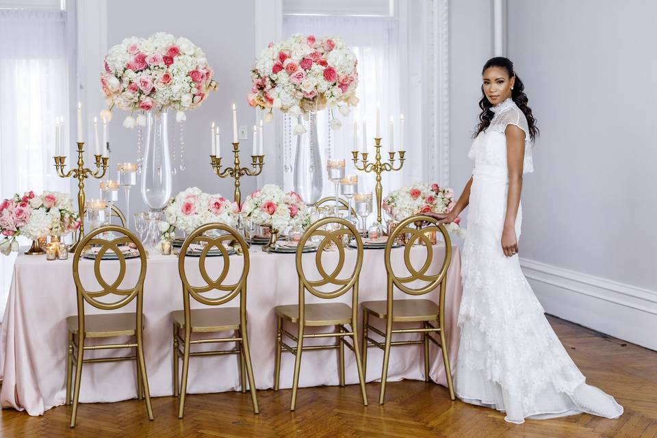 Blush and gold wedding decor with the bride