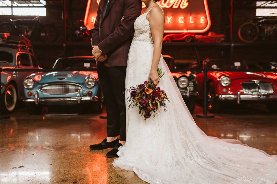 Newlyweds by vintage cars