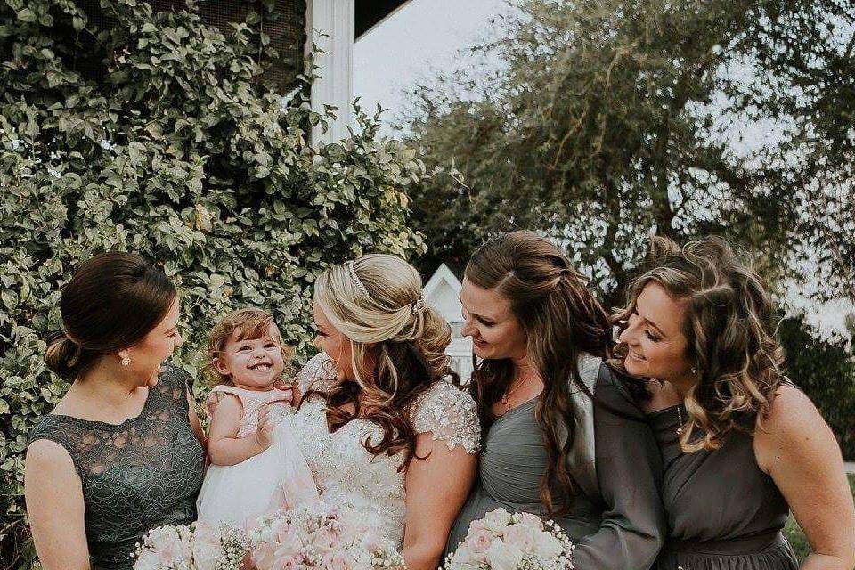 The bride with her bridesmaids and flower girl