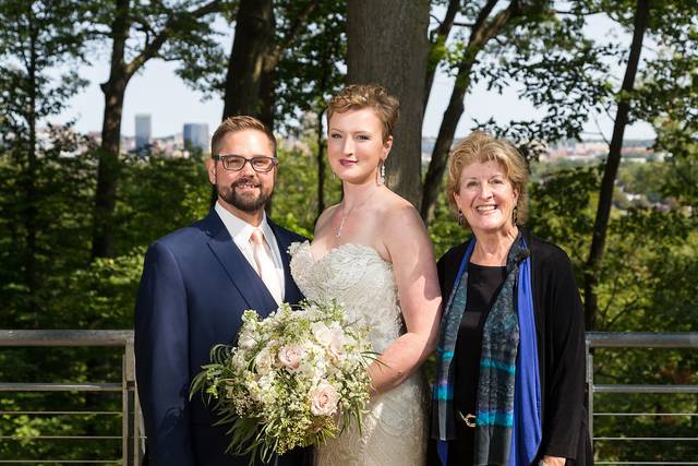 Officiant and newlyweds