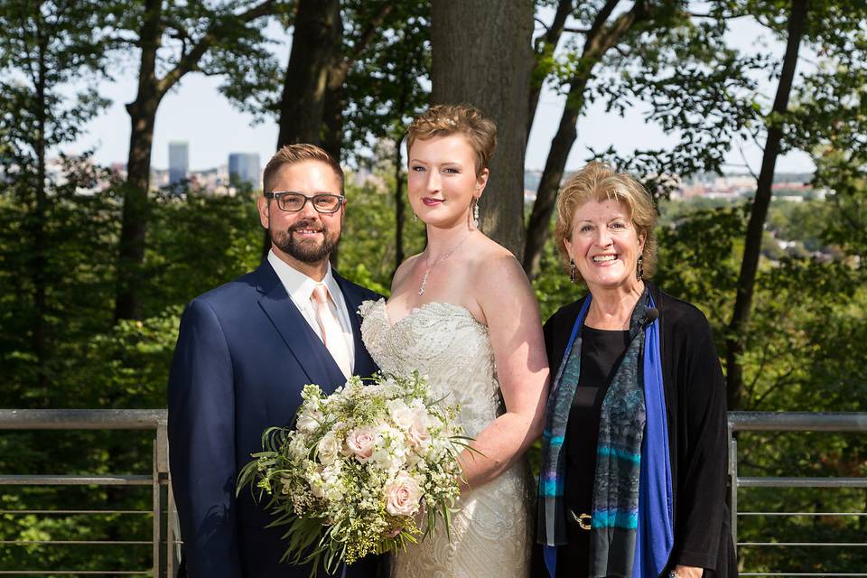 Officiant and newlyweds