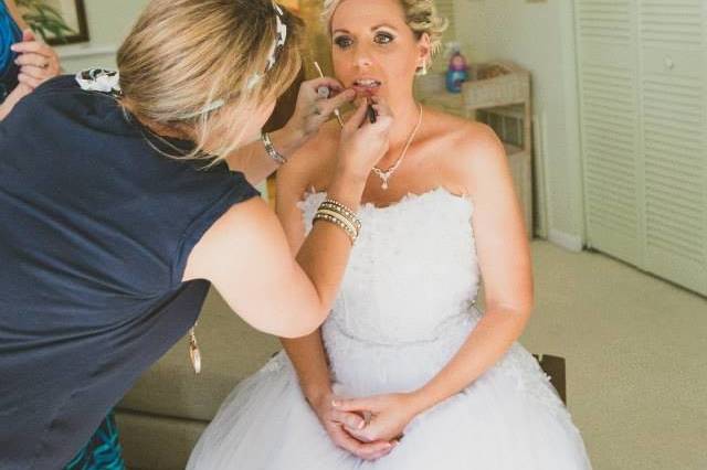 Applying lipstick