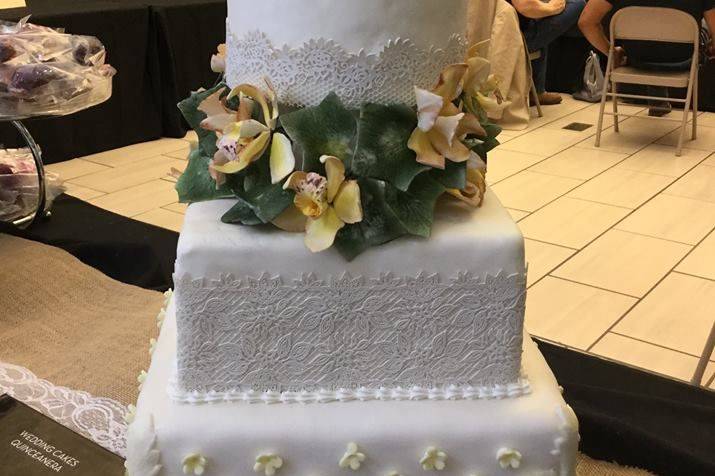 Three tier wedding cake with flowers