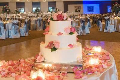 Three layered cake with pink flowers