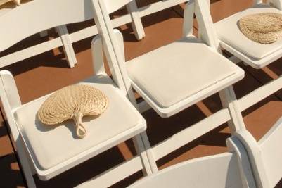 Wedding ceremony chairs setup with fans