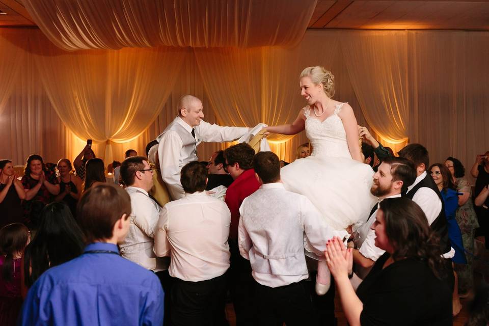 Couple and their guests dancing