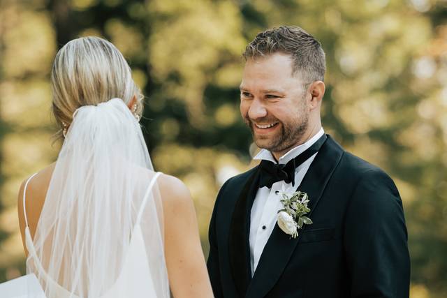 Groom smiling during ceremony