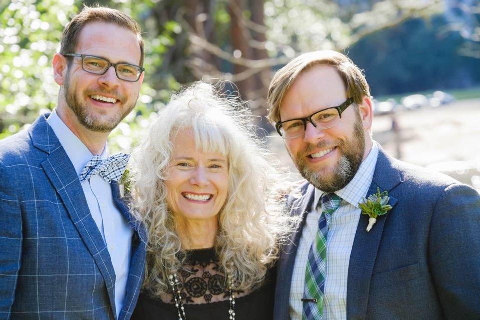 Grooms with the officiant