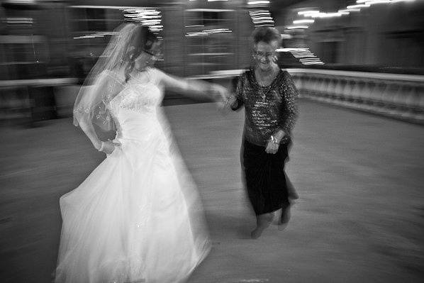 Bride & her mother dancing in the Courtyard at Gaslight Square