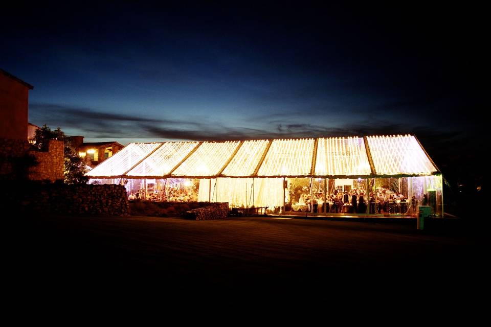 Spectacular tent reception dripping with string lights