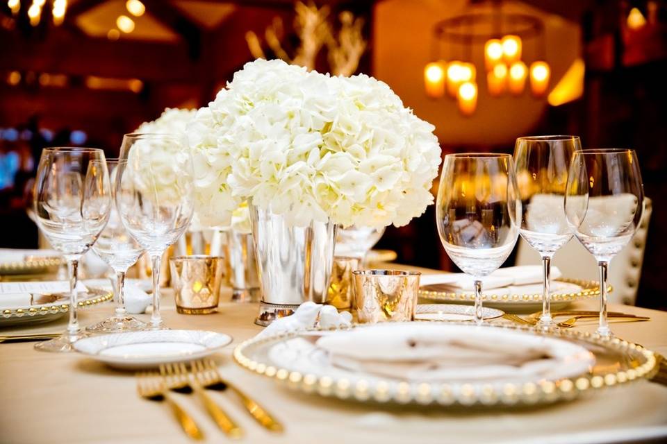 Table settings with floral centerpiece