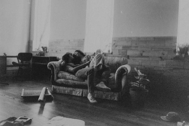Newlyweds hanging out on couch