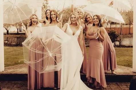 Wedding party with umbrellas