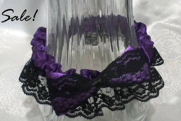 This garter will fit a 14-17 inch leg. It's made from deep purple satin ribbon and black lace. The bow is also made with deep purple satin ribbon and lined with black lace to give it a bit of an classy look.
http://www.etsy.com/listing/86973417/purple-lace-garter-purple-satin-and?ref=v1_other_1